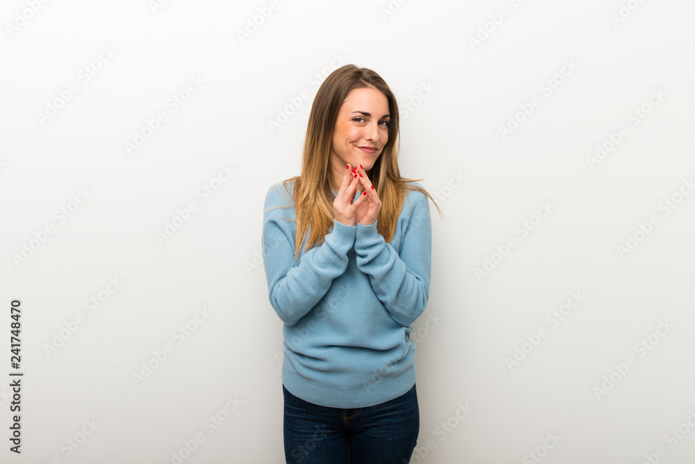 Blonde woman on isolated white background scheming something Blonde woman on isolated white background scheming something