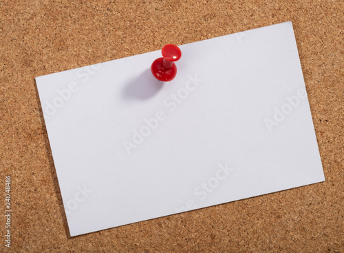 Note paper with pin on the cork board