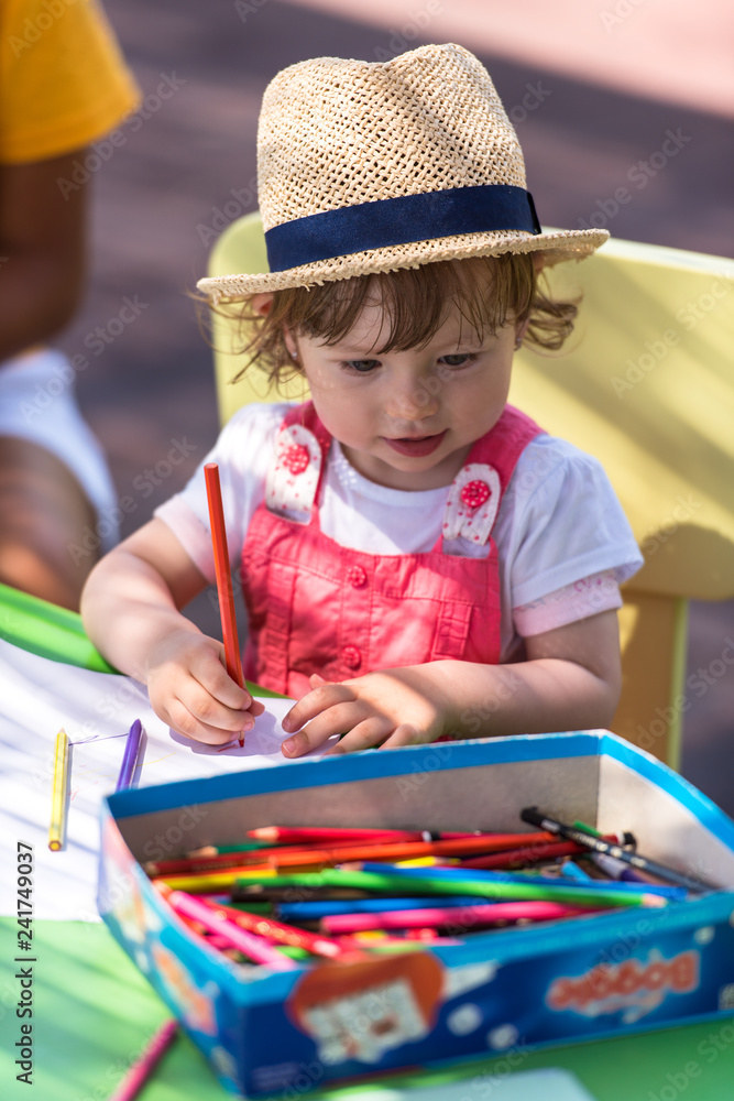 little girl drawing a colorful pictures little girl drawing a colorful pictures