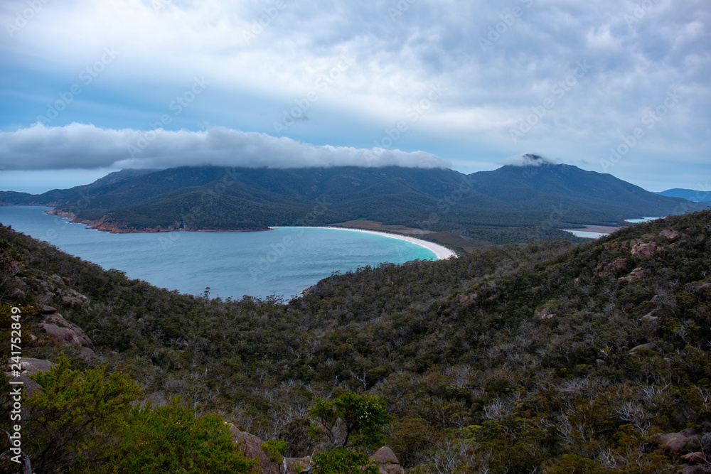 Wineglass Bay, Tasmania on a day with dramatic clouds Wineglass Bay, Tasmania on a day with dramatic clouds