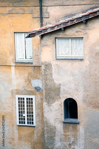 Front facade court view of an old building in Rome, Italy.