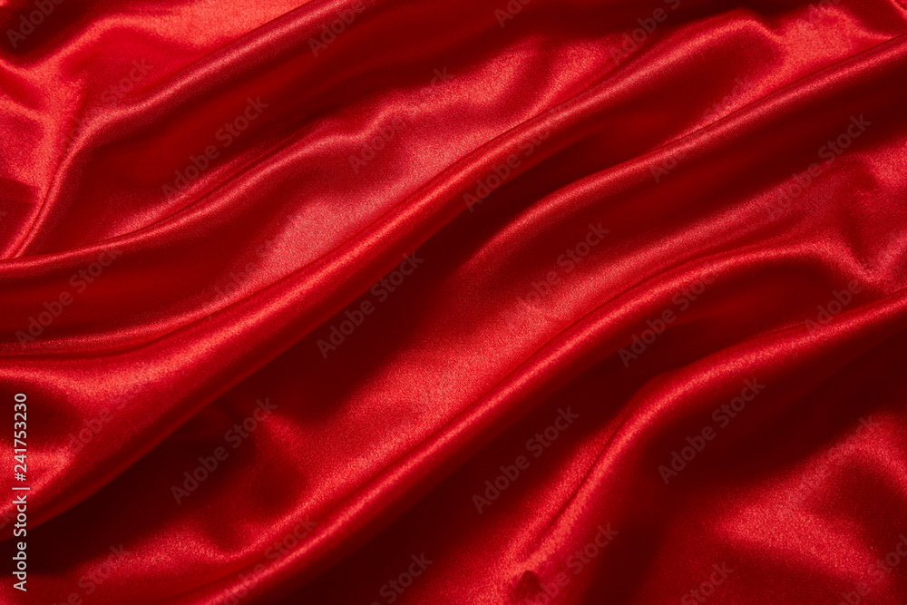 Luxury red satin smooth fabric background for celebration, ceremony, event invitation card or advertising poster Luxury red satin smooth fabric background for celebration, ceremony, event invitation card or advertising poster