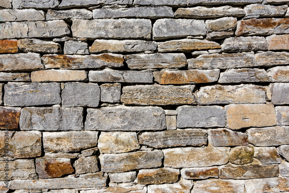 Granite masonry, rough gray stone wall, texture background