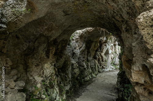Exit from the tunnel in the stone cave in the rock