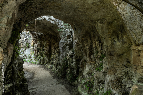 Exit from the tunnel in the stone cave in the rock