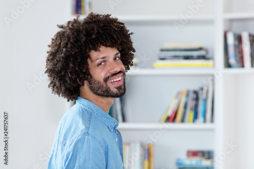 Laughing hipster man with afro hair