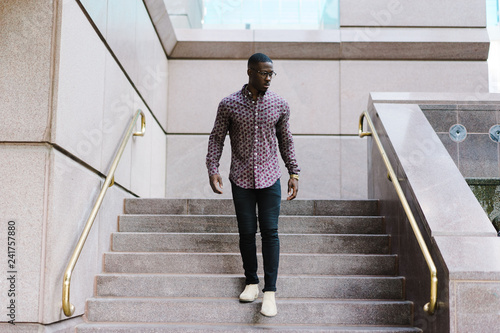 Man walking down the stairs outdoors