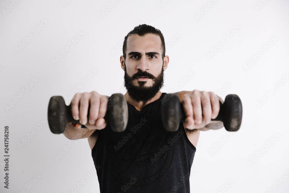 Portrait of man exercising against white background Portrait of man exercising against white background