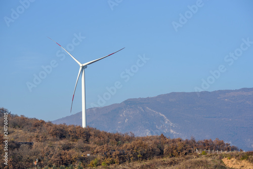 Wind turbines on mountains. Production of clean and renewable energy. Trentino, Italy