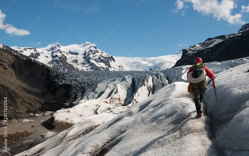 A mountaineer hikes on the Vantajokull glacier at Skaftafell Iceland