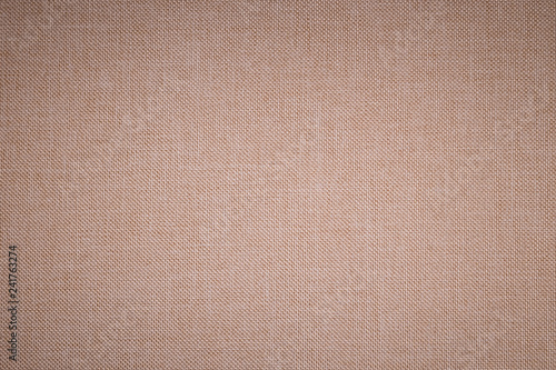Textured background surface of textile upholstery furniture close-up. beige Color fabric structure