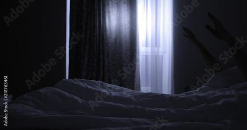 Man with sleepwalking wake up at night and going in the room photo