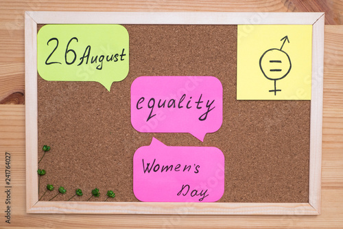 On the cork Board stickers with the inscription August 26 women's equality day photo