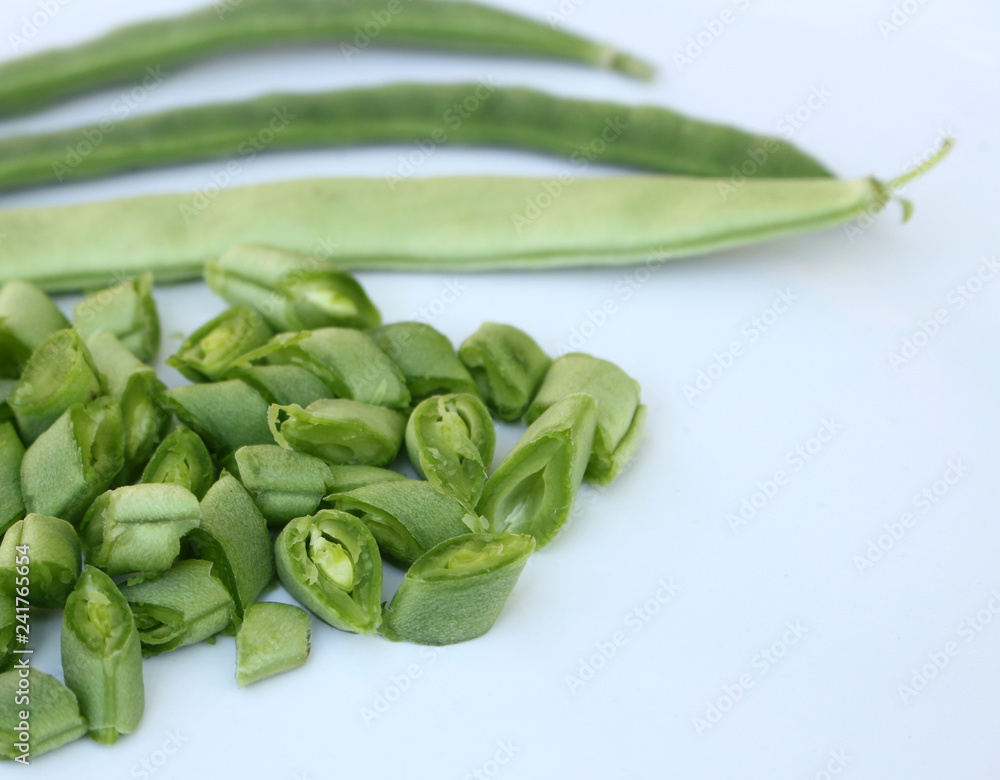 Phaseolus vulgaris, also known as the common bean and green , among other names is a herbaceous annual plant.Green beans on white table.Green concept.