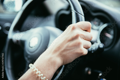 Sports car steering wheel, woman is driving © Patrick Daxenbichler