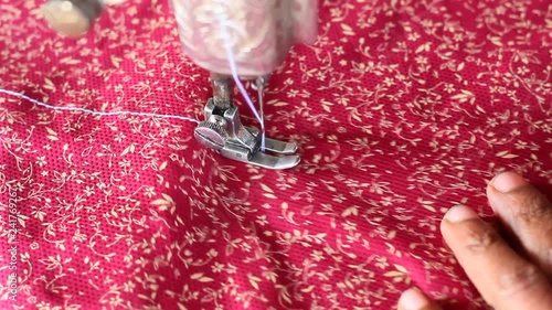sewing the cloth at a shop