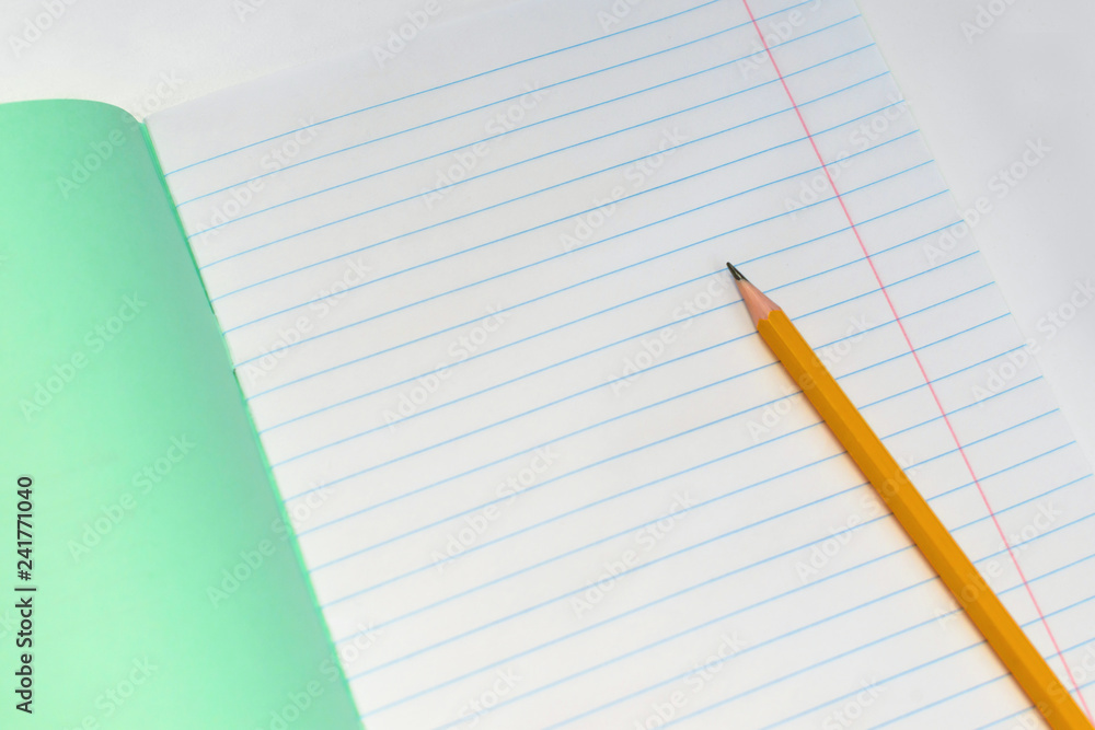 Back to school. Concept of education-orange pencil close-up and composition notebooks for the school year started. Copy space layout. Back to school. Concept of education-orange pencil close-up and composition notebooks for the school year started. Copy space layout.
