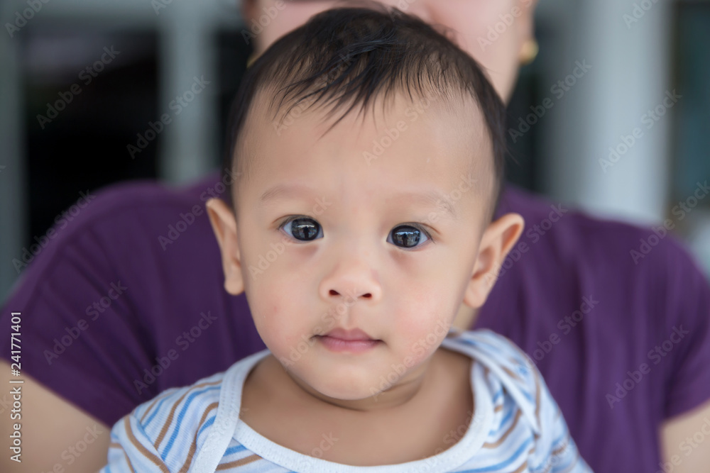 Close up face Baby boy . lovely baby and daddy. family relationship. parents in raising a baby. baby care. image for background, wallpaper, copy space, fashion and article.