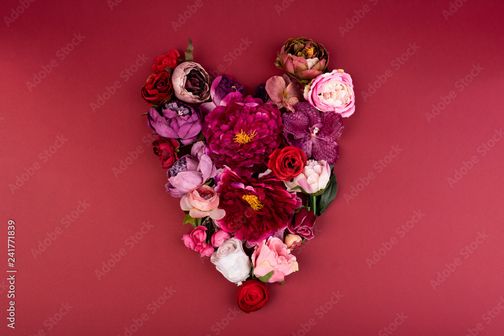 Heart of Flowers on red background. Postcard Heart of Flowers on red background. Postcard