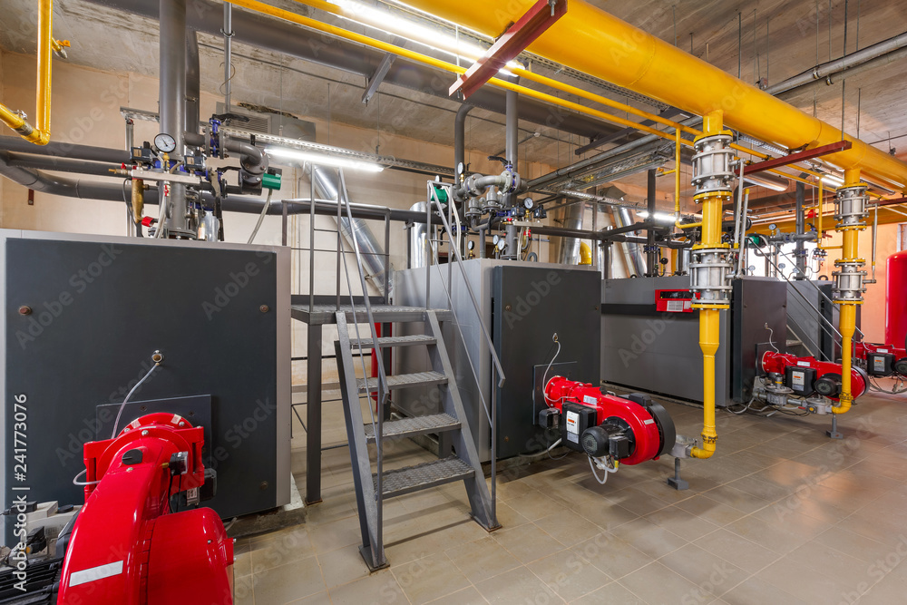 Fototapeta premium interior of industrial, gas boiler room with boilers; pumps; sensors and a variety of pipelines