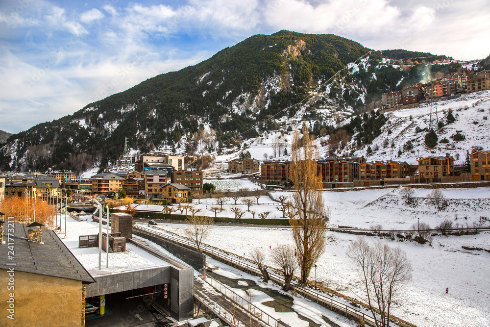 Hotels in the bottom of a mountain with snow during the winter of Andorra in Europe