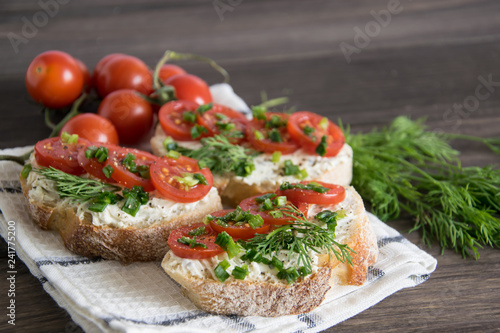 Bruschetta with tomatoes and herbs on a wooden plate, Italian food appetizers