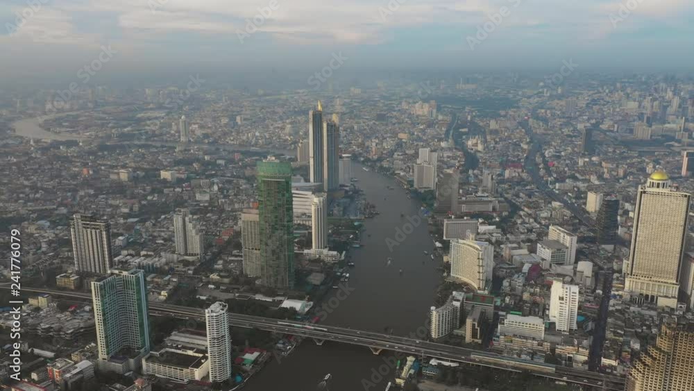 Fly over business center of Bangkok, Sathon thaksin bridge chaophraya river scene Fly over business center of Bangkok, Sathon thaksin bridge chaophraya river scene