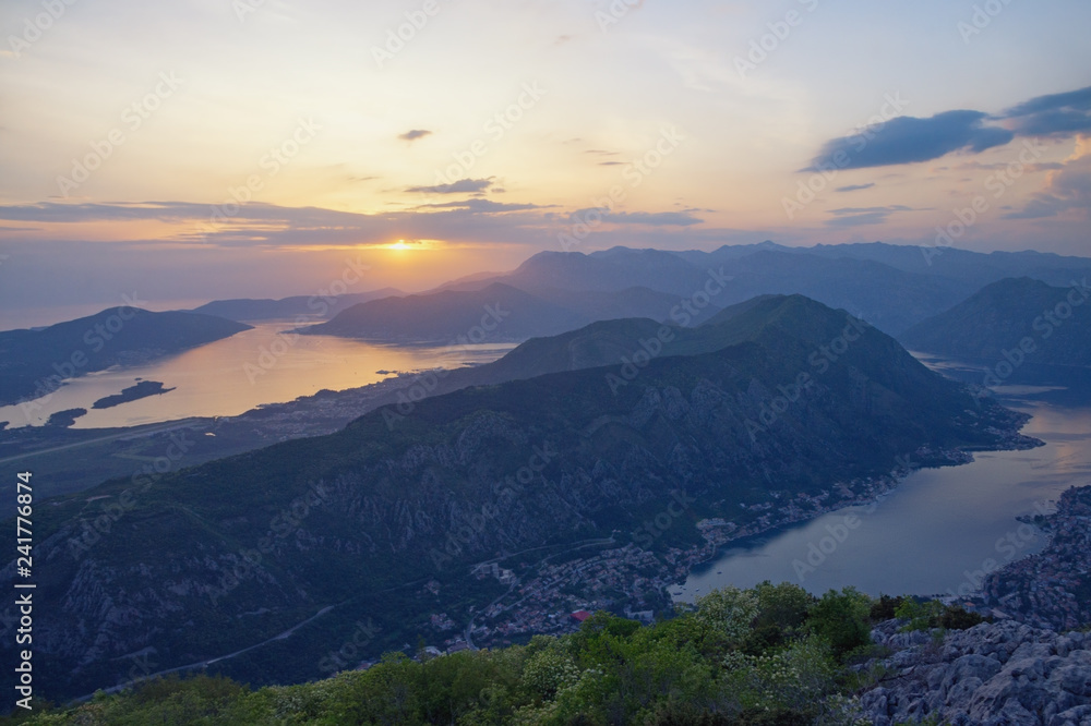 Beautiful Mediterranean landscape at sunset. Montenegro. View of Bay of Kotor and Vrmac Mountain - mountain between Tivat city and Kotor city