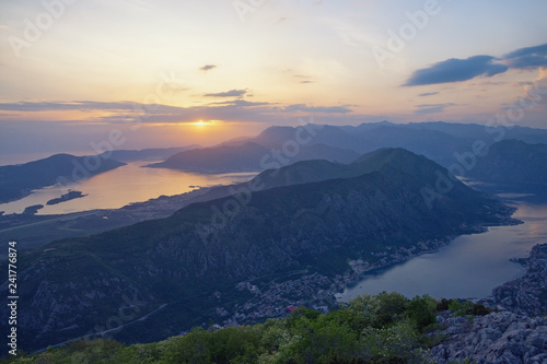 Beautiful Mediterranean landscape at sunset. Montenegro. View of Bay of Kotor and Vrmac Mountain - mountain between Tivat city and Kotor city