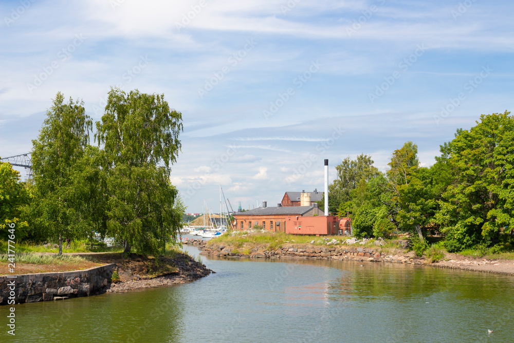 Cove at the pier in the historic fortress island Suomenlinna, Sveaborg in the Gulf of Finland in Finland on a summer day.