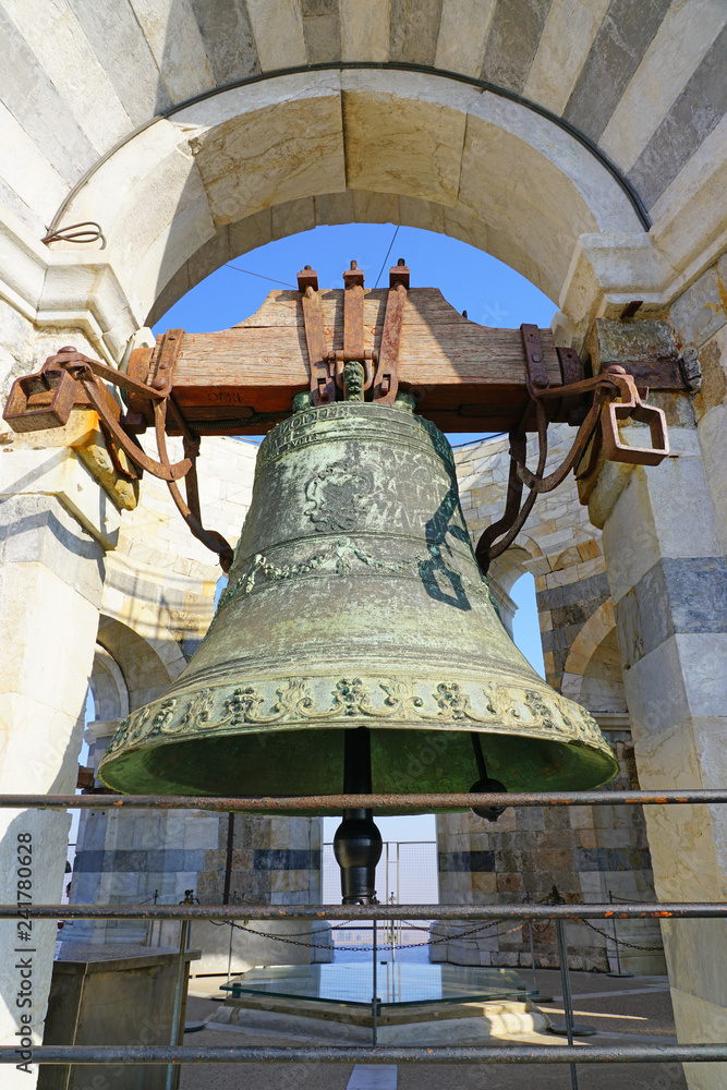 Day view of the bells at the top of the Leaning Tower of Pisa campanile in Tuscany, Italy