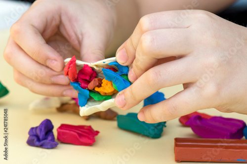 the child's hand molded figurines from colored clay