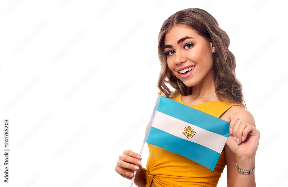 Beautiful young woman with flags of Argentina in her hands on isolated white background Beautiful young woman with flags of Argentina in her hands on isolated white background