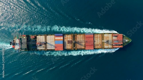 Aerial top view container ship driving on the sea for logistic import export or transportation. photo