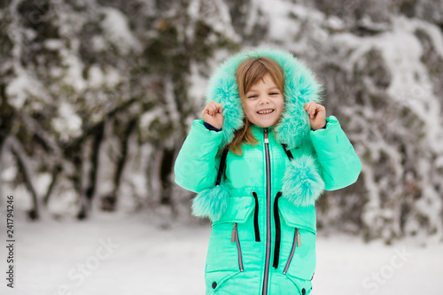 Beautiful portrait of little child enjoying winter