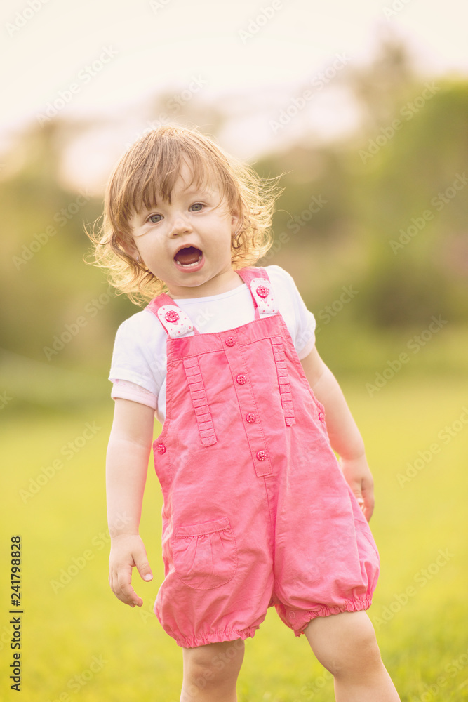 little girl spending time at backyard little girl spending time at backyard
