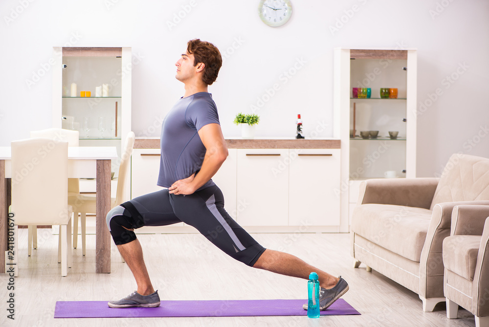 Man exercising for knee injury recovery Man exercising for knee injury recovery
