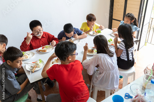 asia students eat in the school
