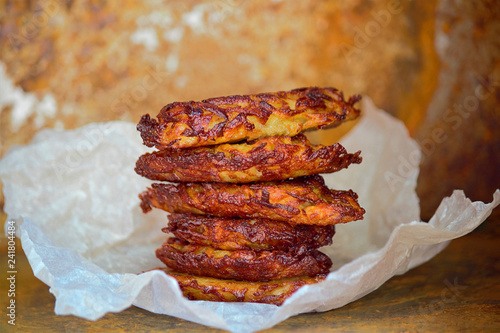 On the table are fritters of potatoes (drannik). Vegetarian food. Gourmet gourmet food. Selective focus, close up photo