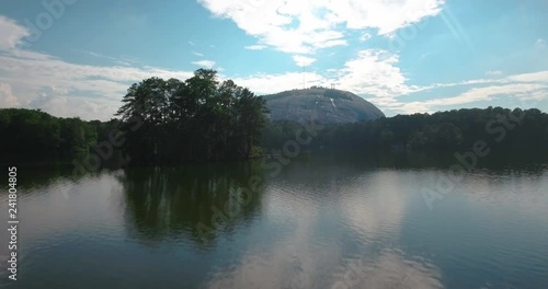 Aerial View of Stone Mountain Flying Over Lake in Georgia photo