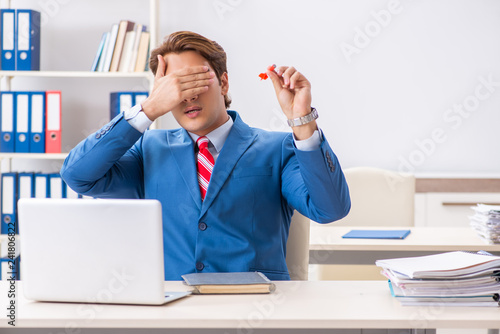 Businessman throwing dart in business concept photo