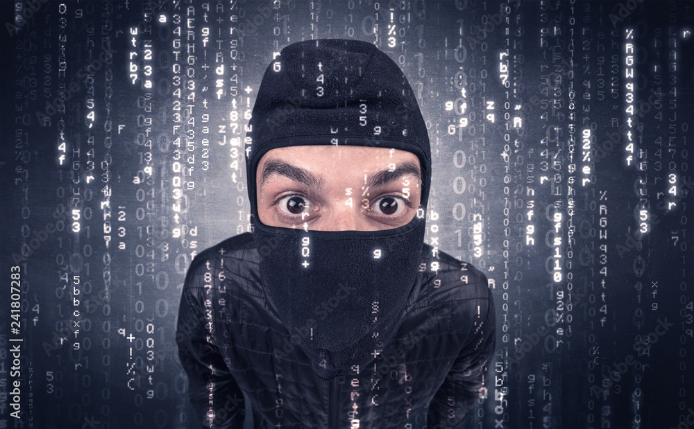 Burglar in action with encoded concept and his tools in his hand. Burglar in action with encoded concept and his tools in his hand.