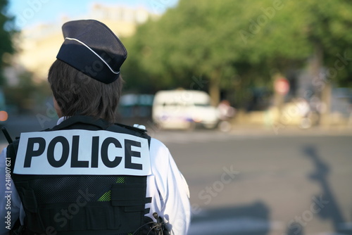 Paris,France-October 17, 2018: A police officer on duty near au Change bridge on the Seine River
