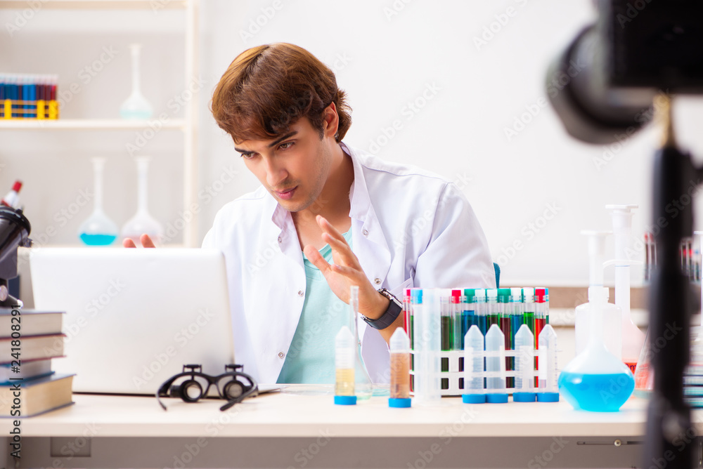 Chemist blogger recording video for his blog Chemist blogger recording video for his blog