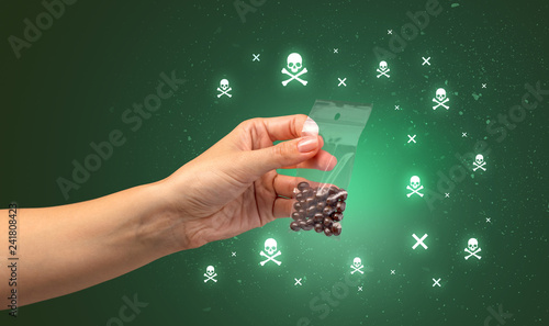 Female handing over pills with skull concept  photo