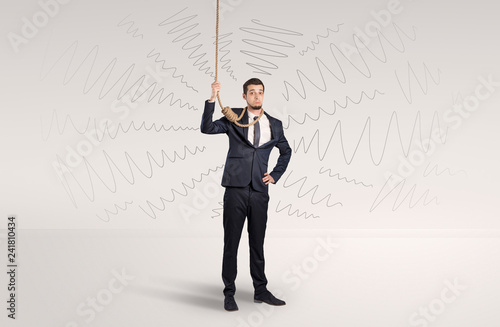 Hopeless young businessman trying to suicide with question signs concept
 photo