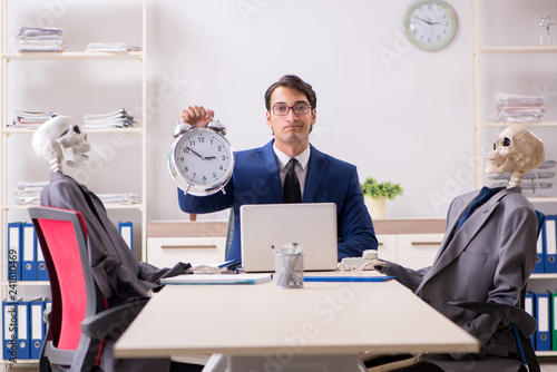 Photos Funny business meeting with boss and skeletons