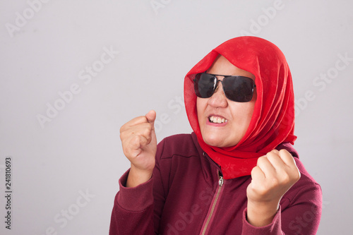 Muslim Lady in Red Shows Angry Gesture