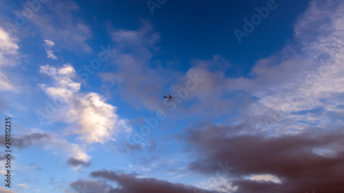 Passenger airliner in the colorful sky