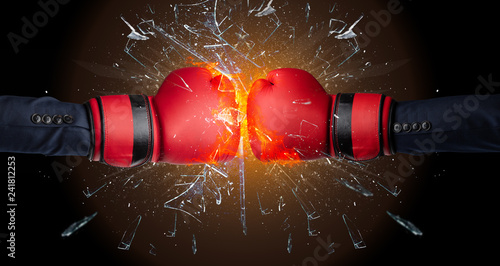 Two hands fighting and breaking a glass into small pieces  © ra2 studio